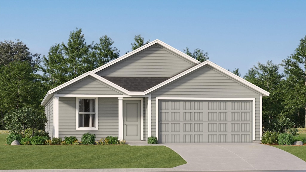 view of front of property featuring a garage and a front lawn