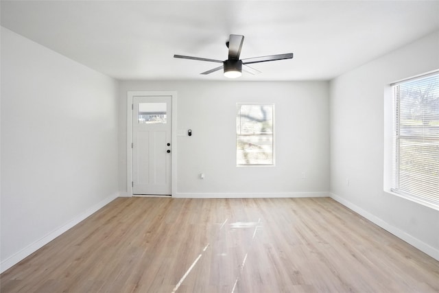 entrance foyer with a healthy amount of sunlight, ceiling fan, and light hardwood / wood-style flooring