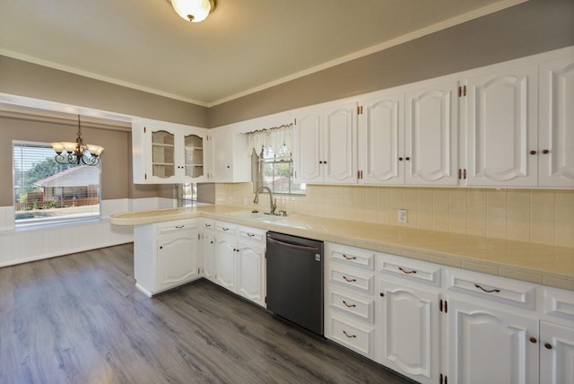 kitchen featuring white cabinetry, sink, an inviting chandelier, stainless steel dishwasher, and dark hardwood / wood-style floors