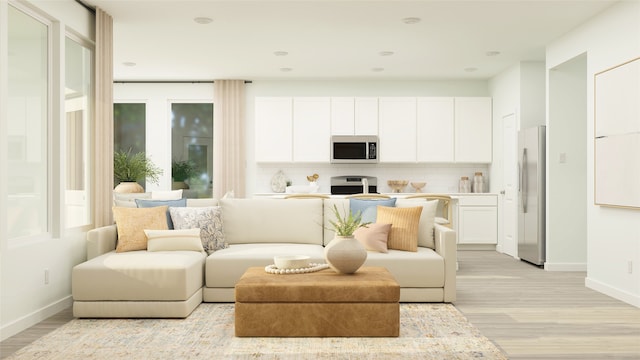 living room with light hardwood / wood-style flooring