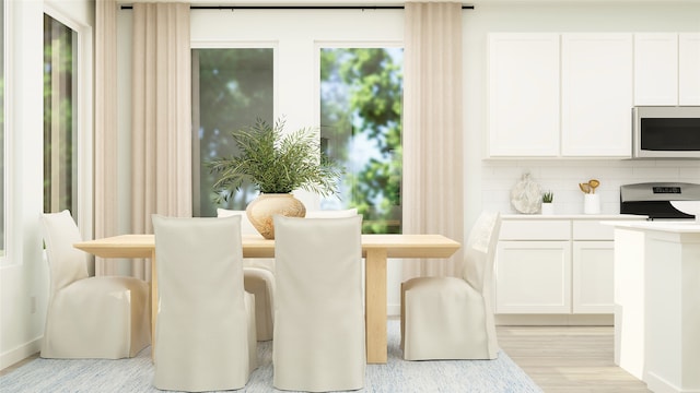 dining area with light hardwood / wood-style floors