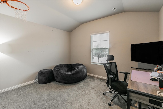 home office with carpet floors and vaulted ceiling