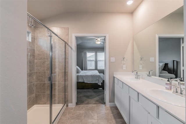 bathroom with an enclosed shower, vanity, ceiling fan, and tile patterned flooring