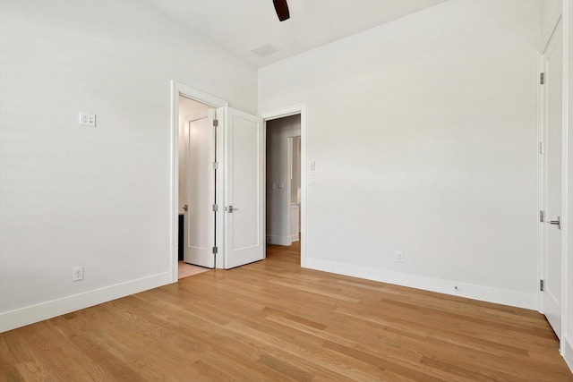 unfurnished bedroom with ceiling fan and light hardwood / wood-style flooring