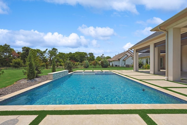 view of pool featuring a patio and a lawn