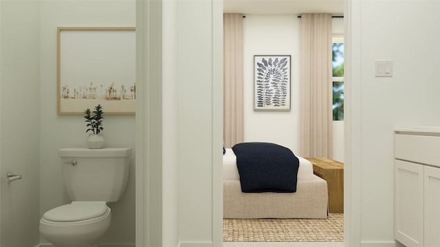 bathroom with vanity, toilet, and a wealth of natural light