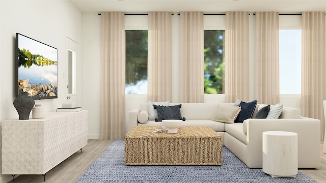 living area featuring a wealth of natural light and hardwood / wood-style floors