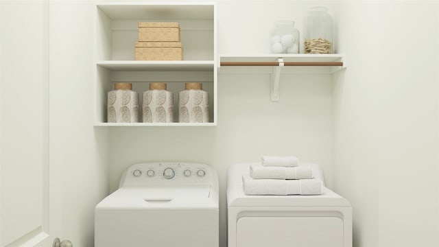 clothes washing area with washer and dryer