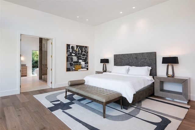 bedroom featuring hardwood / wood-style flooring and access to exterior