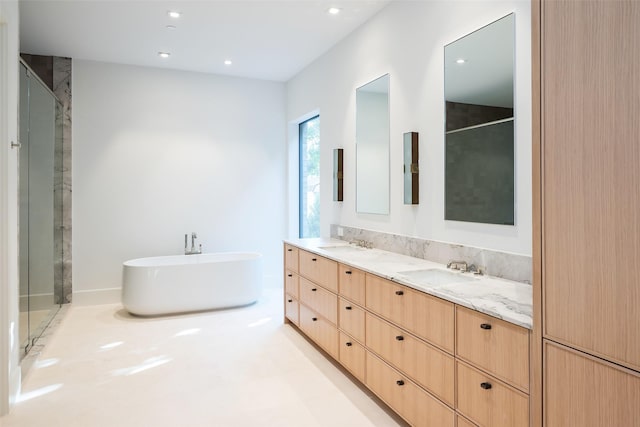 bathroom featuring vanity and shower with separate bathtub