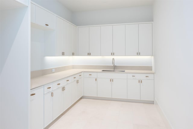 kitchen with white cabinets and sink