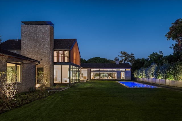 view of yard with a fenced in pool