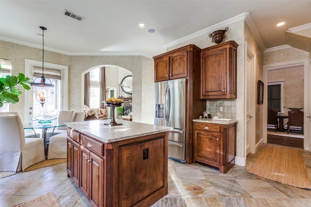 kitchen with decorative light fixtures, a center island, ornamental molding, stainless steel refrigerator with ice dispenser, and a notable chandelier