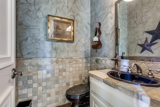 bathroom with vanity and toilet