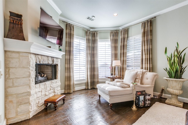 sitting room featuring dark hardwood / wood-style flooring, a fireplace, and ornamental molding