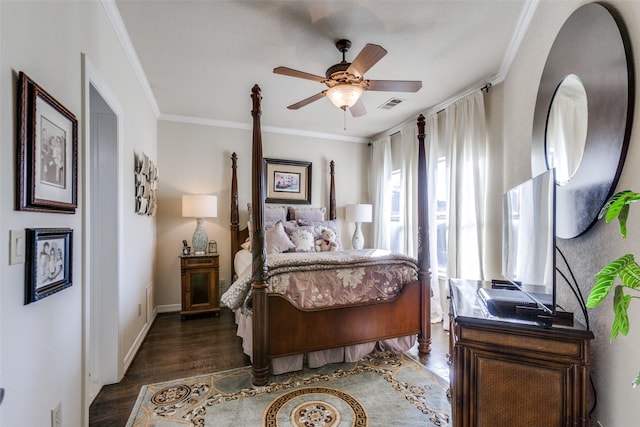 bedroom featuring ceiling fan, ornamental molding, and dark hardwood / wood-style floors