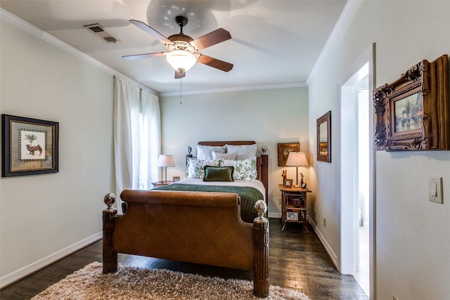 bedroom featuring dark hardwood / wood-style flooring, ceiling fan, and crown molding