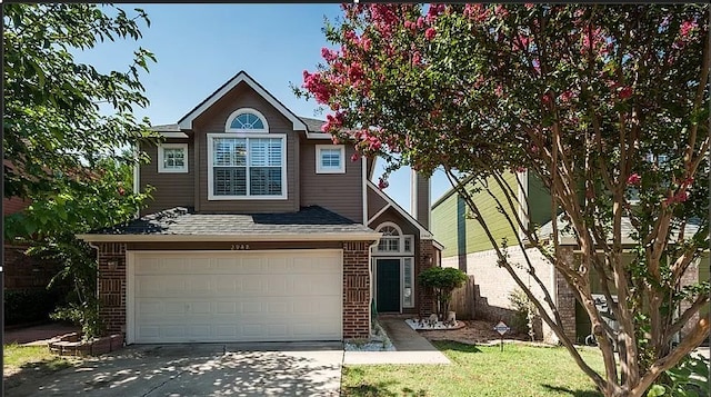 view of front of property with a garage and a front yard