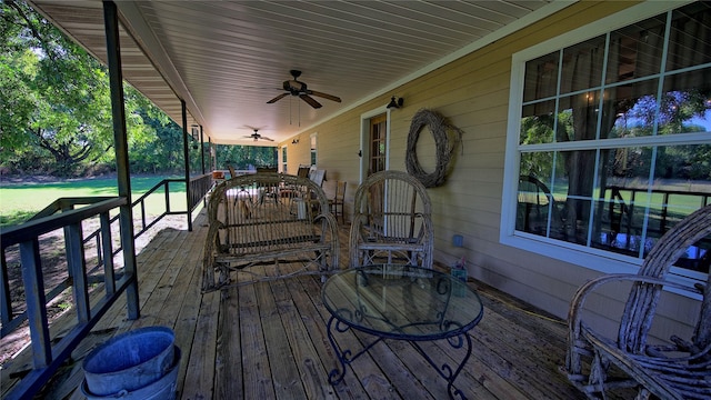 wooden terrace with ceiling fan and a porch