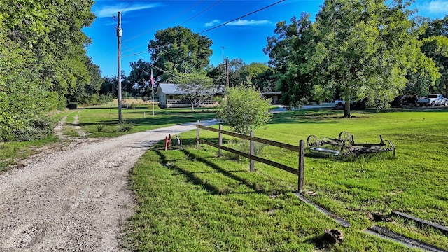 view of property's community with a yard