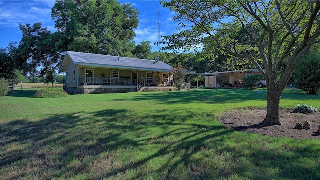 view of yard with covered porch