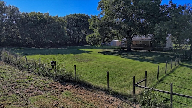 view of yard with a rural view