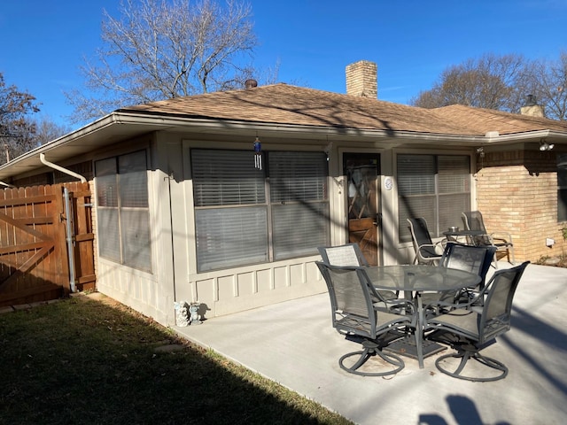 rear view of property featuring a patio area