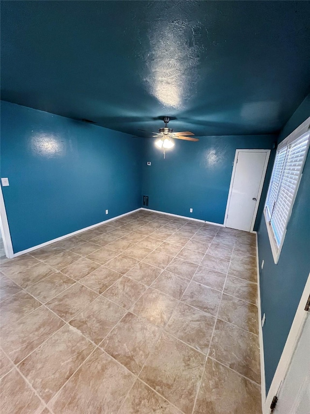 spare room with a textured ceiling