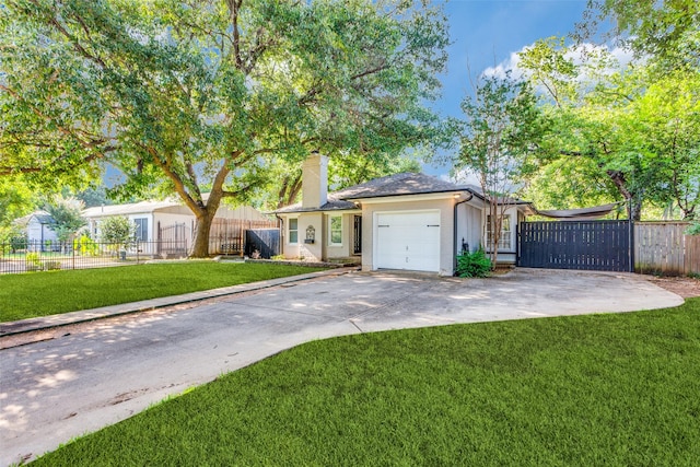 ranch-style house featuring a garage and a front yard