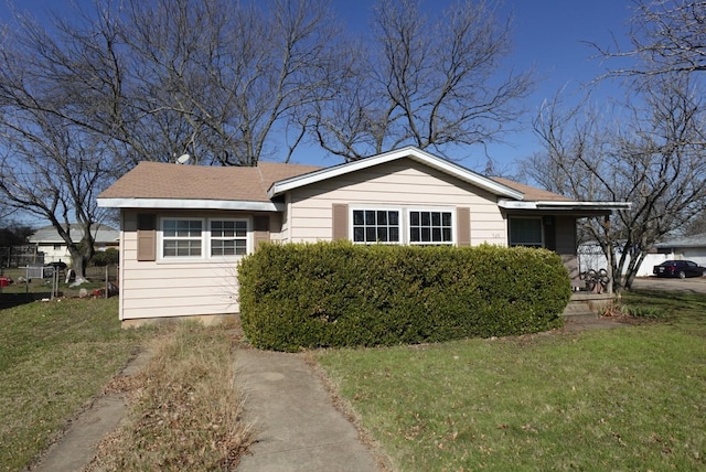 view of front of home with a front lawn