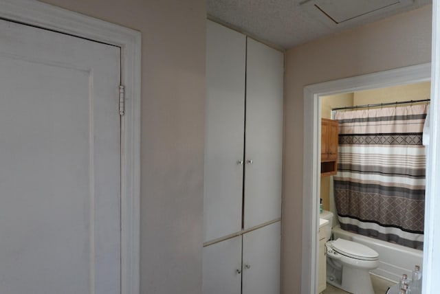 full bathroom with shower / tub combo, vanity, and toilet