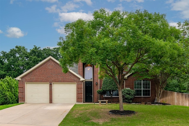 obstructed view of property with a garage and a front lawn