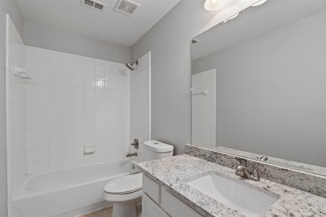 full bathroom with washtub / shower combination, tile patterned floors, vanity, and toilet