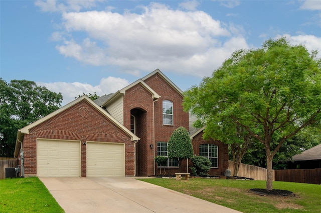 view of property featuring a front lawn, central AC unit, and a garage