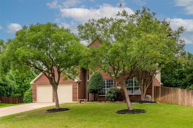 view of front of property featuring a front yard and a garage