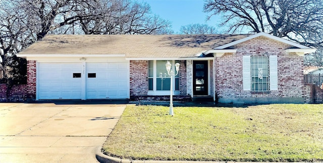 ranch-style home featuring a garage and a front lawn