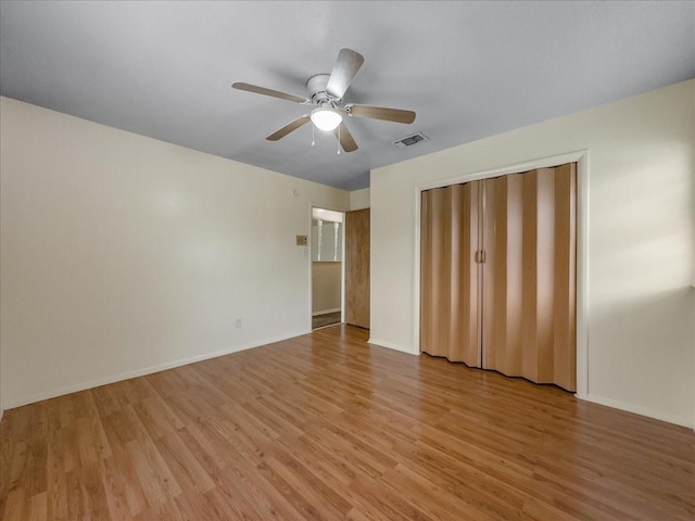 unfurnished bedroom featuring ceiling fan and light hardwood / wood-style floors