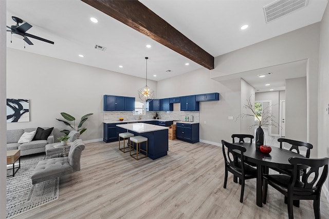 interior space with ceiling fan, beamed ceiling, and light wood-type flooring