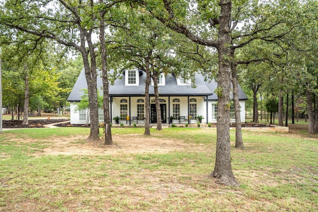 view of front of property with a front lawn and a porch