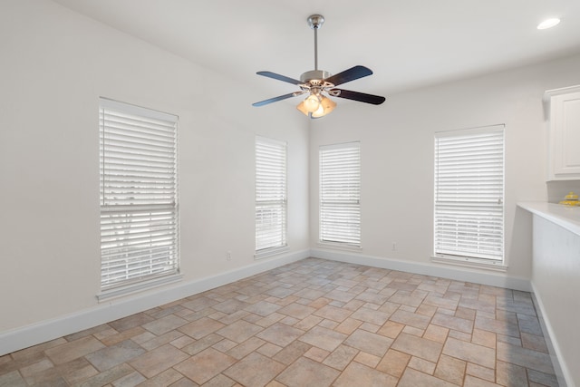 spare room featuring ceiling fan