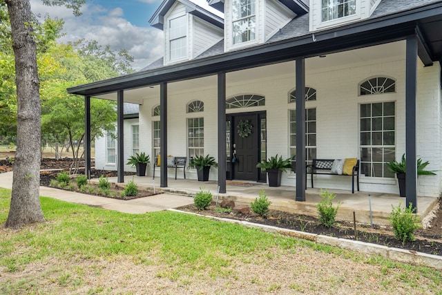 doorway to property featuring a porch