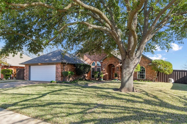 view of front facade with a garage and a front yard