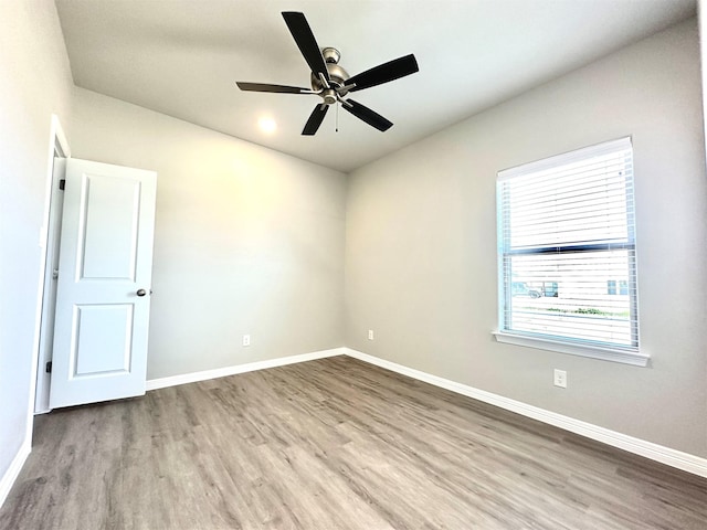 unfurnished room with light wood-type flooring and ceiling fan