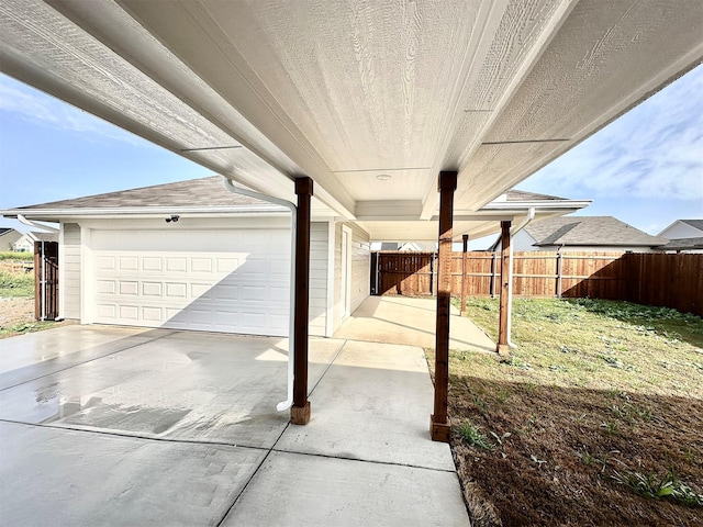 garage featuring a lawn