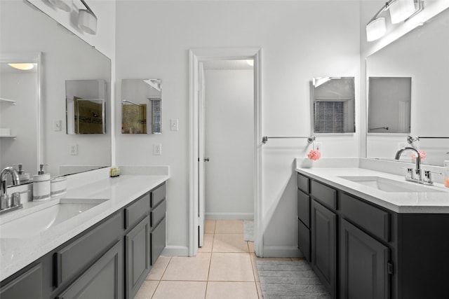 bathroom featuring tile patterned flooring and vanity