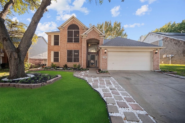 view of front property with a front lawn and a garage