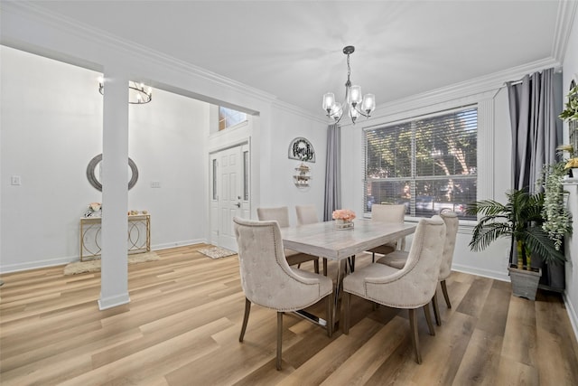 dining space with a notable chandelier, light wood-type flooring, and crown molding