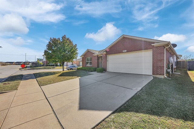 ranch-style house with a front lawn and a garage