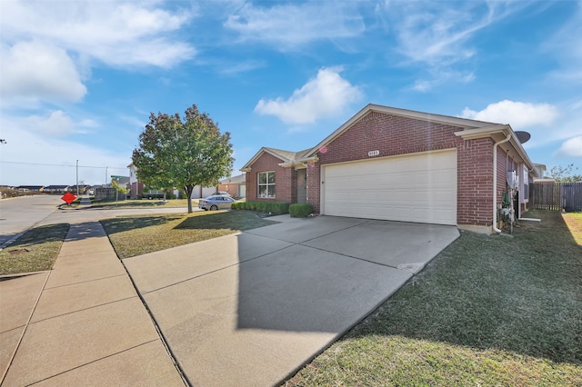 ranch-style home featuring a front yard and a garage