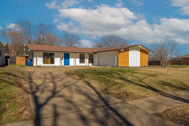 ranch-style home featuring a garage and a front yard